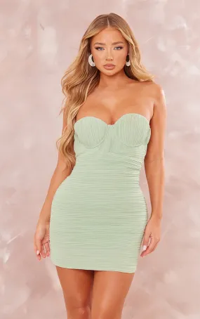 Robe-bustier moulante vert sauge drapée plissée à armatures